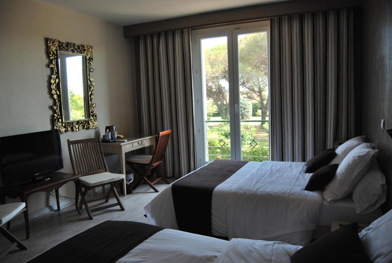 Logis Hotel Restaurant Les Aubuns Caissargues Quarto foto